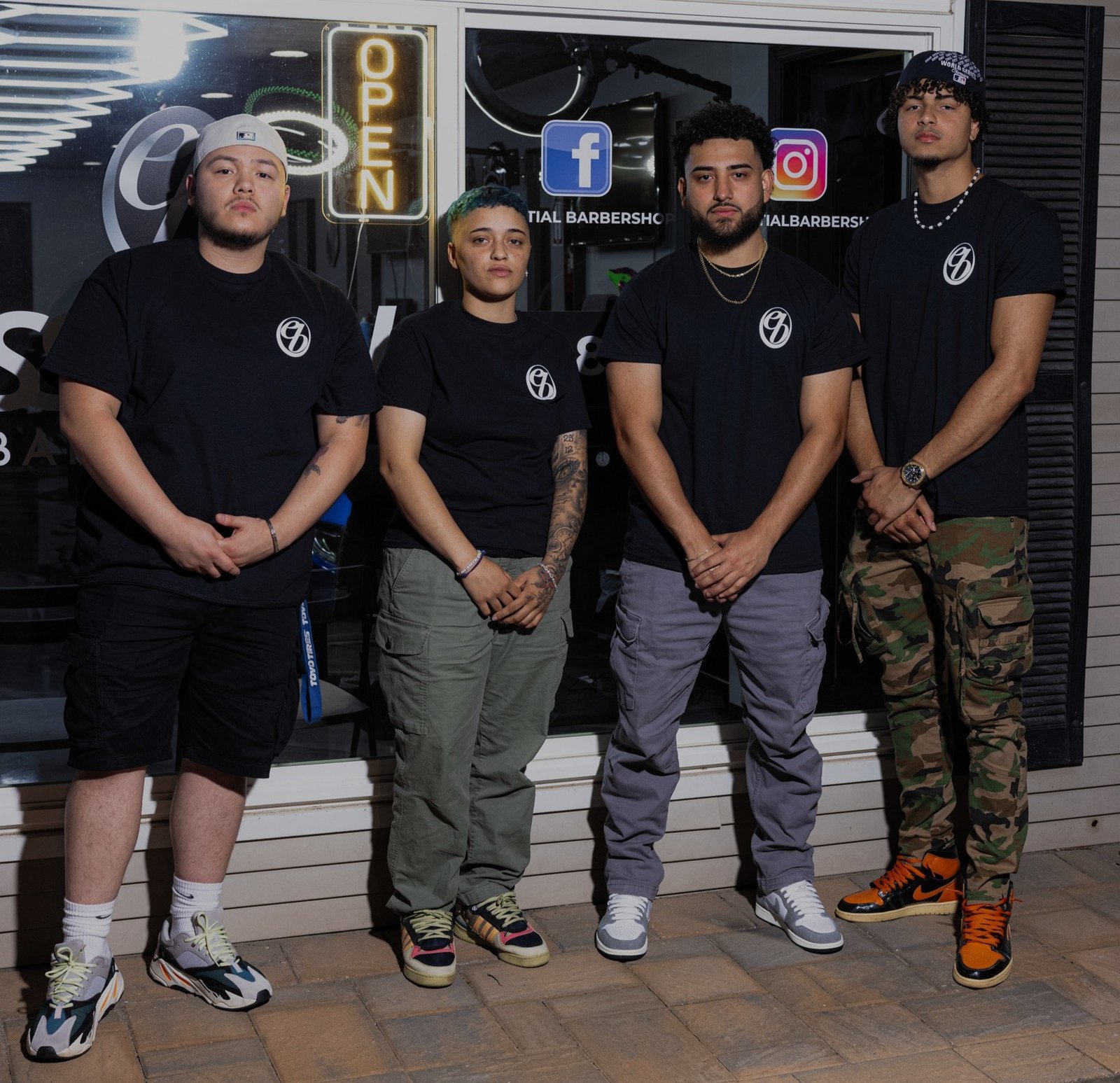 The Essential Barbershop team outside the shop